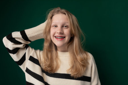 Woman With Blonde Hair Wearing a Striped Sweater