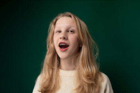 Woman With Long Blonde Hair and Sweater