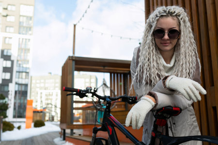 Woman Dressed as Wolf Standing Next to Bikeの写真素材