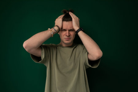 Man Holding Head in Frustration