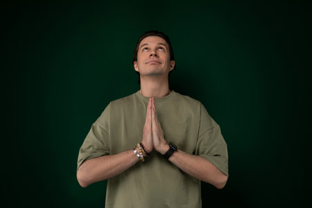 Man Standing in Front of Green Wall
