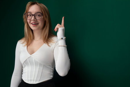 Woman Wearing Glasses Points at the Cameraの写真素材