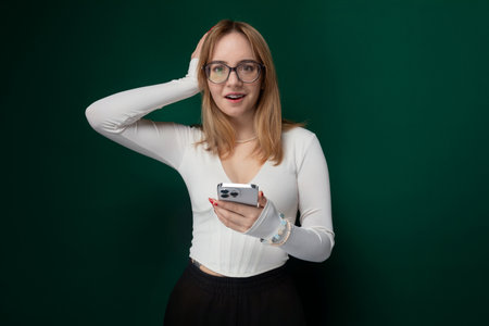 Woman With Glasses Holding Cell Phoneの写真素材