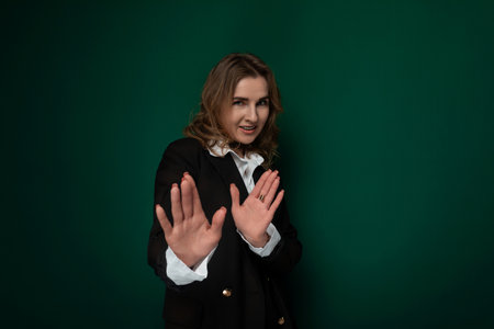 Woman in Black Jacket Holding Out Handsの写真素材