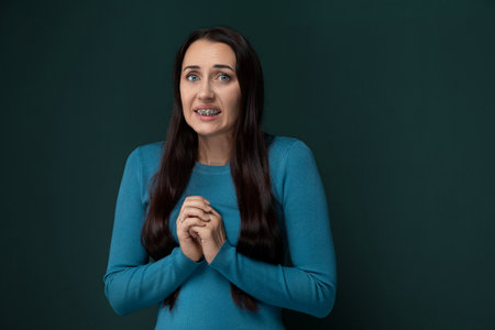Woman Standing With Folded Handsの写真素材