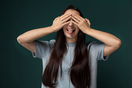 Woman Covering Eyes With Handsの写真素材