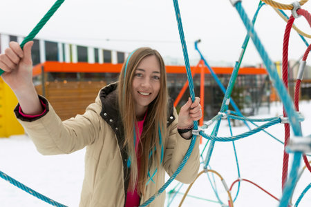 Woman Standing in Front of Colorful Structure
