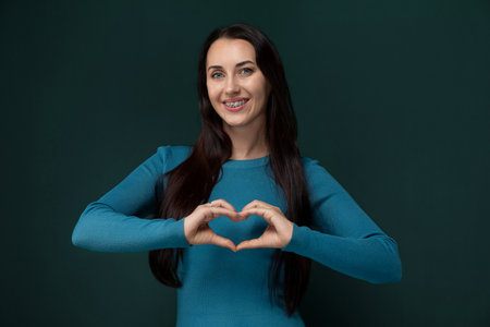 Woman Making Heart With Handsの写真素材
