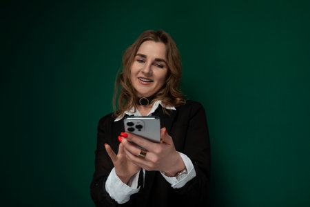 Woman Holding a Smart Phone in Her Handsの写真素材