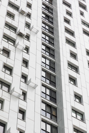 High-rise apartment buildings in a modern residential area highlighting rental and mortgage...
