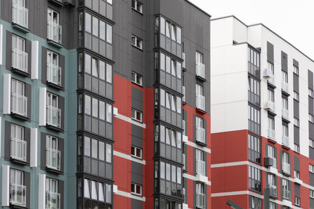 Modern high-rise apartment buildings in a vibrant residential area showcasing urban living and property optionsの写真素材