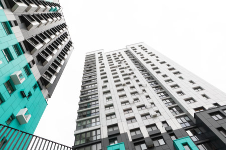High-rise apartment buildings in a residential area showcasing modern architecture and potential for rent and mortgage opportunitiesの写真素材