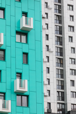 High-rise apartment buildings in a vibrant residential area showcasing various designs and living options for renters and buyersの写真素材