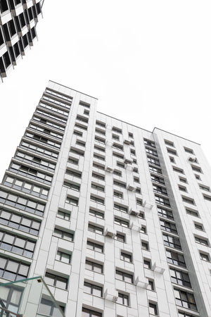 Modern high-rise apartment buildings in a residential area reflect urban living trends and housing market dynamicsの写真素材