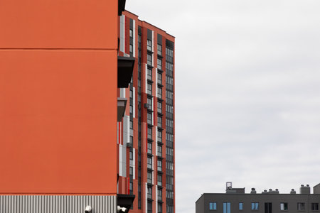 A view of modern high-rise apartment buildings in a residential area, showcasing urban living and property options for rent or mortgageの写真素材