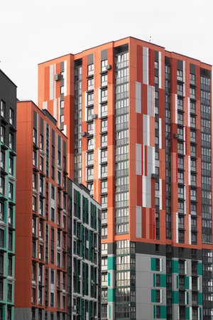 High-rise apartment buildings in a modern residential area with a focus on living, mortgages, and property insurance optionsの写真素材