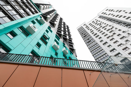 High-rise residential buildings in urban area emphasizing rental and mortgage options along with...