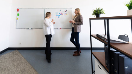 Business professionals discussing strategy in a modern office during a work session
