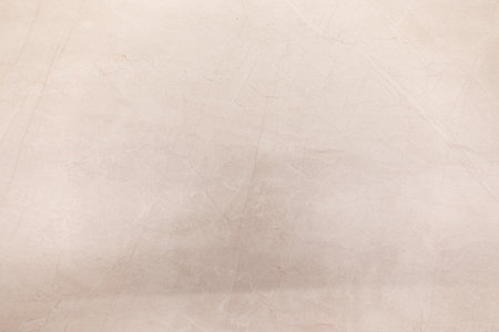 Unique textured surface with subtle light shadows highlighting intricate patterns in a minimalist...
