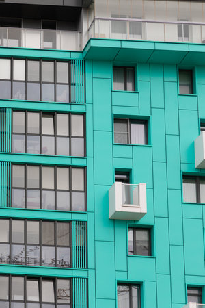 Tall residential buildings showcasing modern architecture in a vibrant neighborhood discussing rental opportunities and property insuranceの写真素材