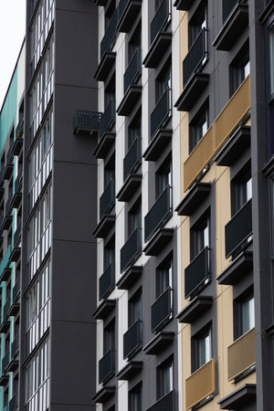 High-rise apartment buildings in a residential area showcasing diverse designs and accommodations for renters and homeownersの写真素材