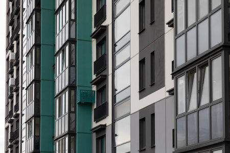 Residential high-rise apartment buildings in a modern urban neighborhood promoting rental and...