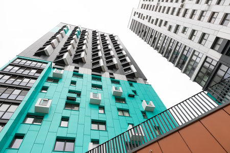 High-rise apartment buildings in a modern residential area showcasing contemporary architecture and...