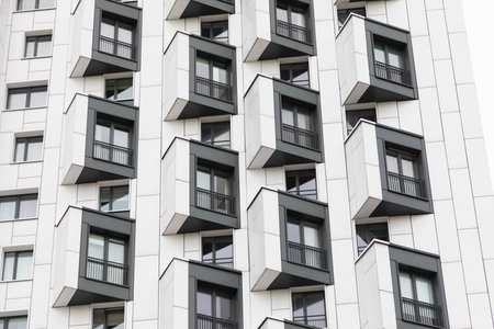Modern high-rise apartment buildings displaying unique architectural design in a vibrant residential...