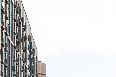 High-rise apartment buildings in a residential area illustrating urban living and property considerations for renters and buyersの写真素材