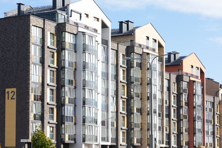 Modern high-rise apartment buildings in a vibrant residential area reflecting urban living and property opportunitiesの写真素材
