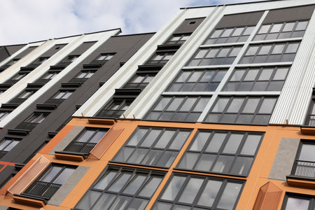 Modern high-rise apartment buildings in a residential area showcasing contemporary design and rental...