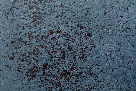 Unique texture of rough blue surface with scattered patterns resembling abstract art in natural...