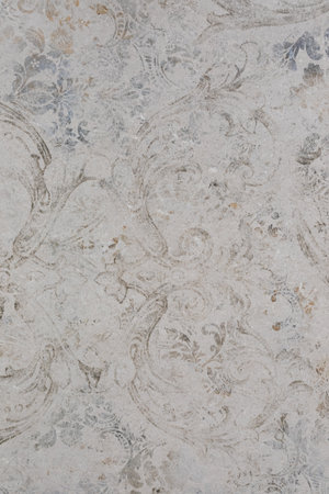 Decorative grey and white pattern on smooth surface highlighting intricate designs and textures