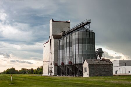 Prairie Grain Elevator Against Stormy Skyの写真素材