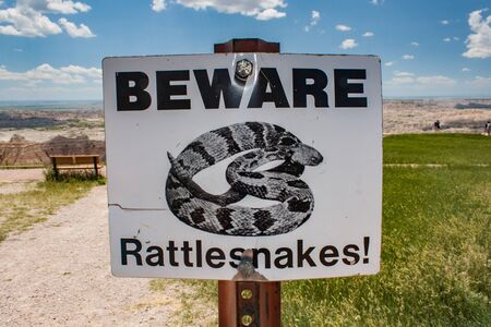 BEWARE rattlesnakes warning sign in South Dakota badlands