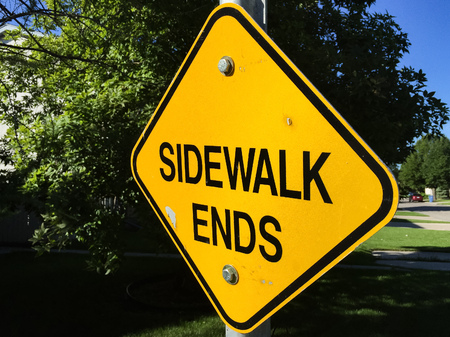 Bright Yellow Diamond Shaped SIDEWALK ENDS signの写真素材