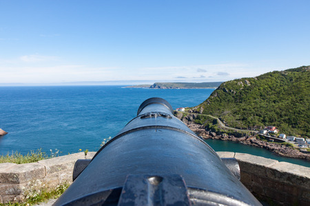 Looking down an old cannon toward the Atlantic Oceanのeditorial素材