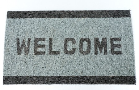 Welcom doormat placed near the entranceの写真素材
