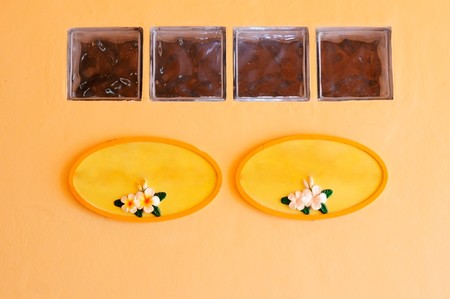 Yellow board on the orange wall in the hotelの写真素材