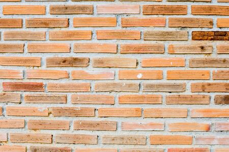 Orange brick wall of old house in the rural,Thailandの写真素材