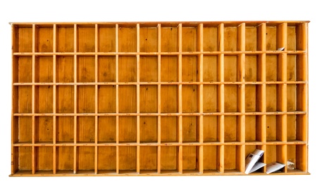 Classic wooden mail box on the white wall of modern apartment.