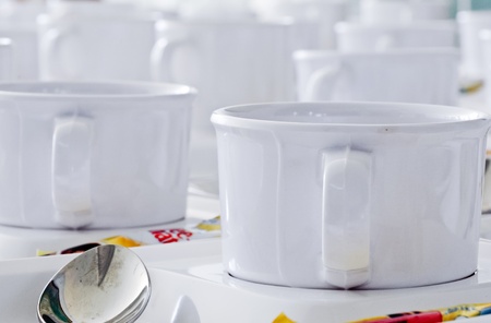 White coffee cup  arranged in a row in front of meeting roomsの写真素材