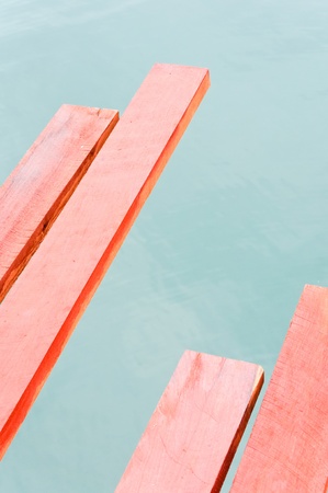Red timber on the old wooden bridge, waiting to be repaired,Kanchanaburi Thailandの写真素材