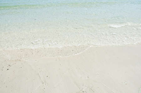 Soft wave on the clear white sand.