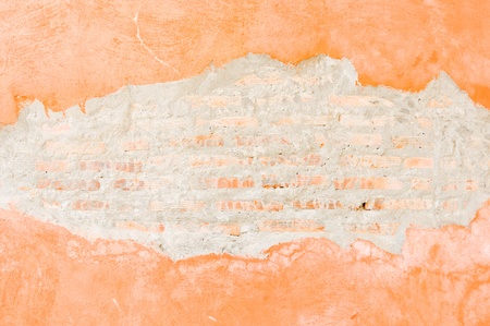 Orange brick walls which cracked until see the brick inside.の写真素材