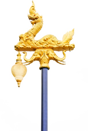 Traditional golden Thai dragon statue on the pole in white background.の写真素材