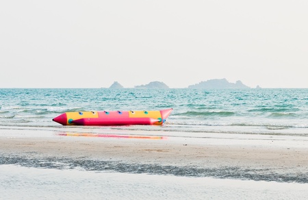 Lonely banana boat on the beach of Thailand.