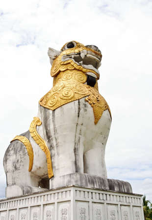 White lion sculptures in Burma style in front of the ancient city の写真素材
