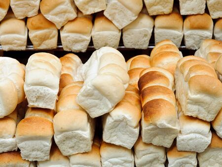 Lot of bread on the shelves of small shop in the zoo 