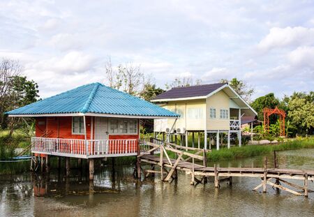 Colorful wooden house on the lake of national park のeditorial素材